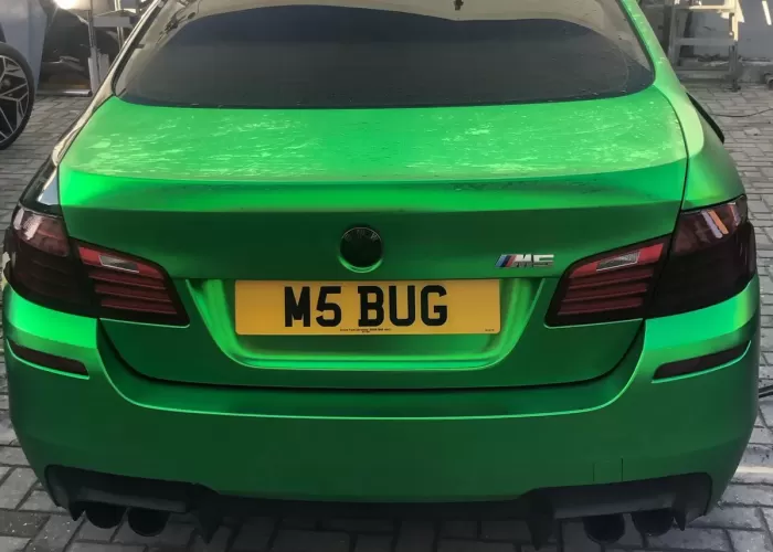 Green BMW M5 with M5 BUG private plate